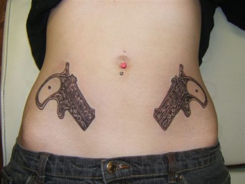 lower hip tattoos. Gun Hip Tattoos