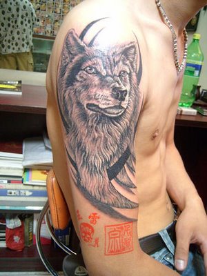 On upper arm with tribal ink
